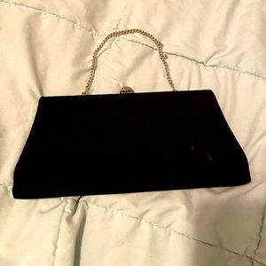 Black satin clutch with rhinestone enclosure